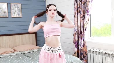 Dakota Doll with pigtails plays with her pussy