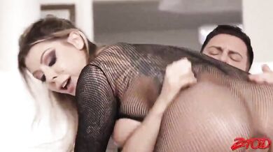 Oiled body with fishnet lingerie