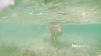 Alisa Amore nude on the beach and in the sea