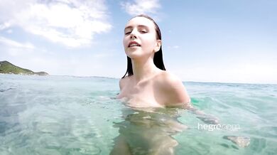Alisa Amore nude on the beach and in the sea