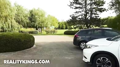 REALITY KINGS - Ann Joy unbuttons her blouse to play with her pussy in the car before Mark Zane catches her and fucks her