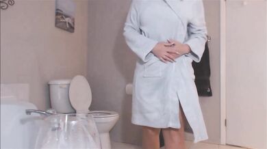 Cute young blonde girl plays with a toy on webcam