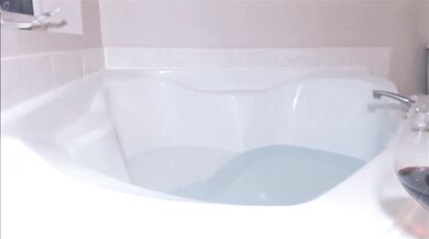 Cute young blonde girl plays with a toy on webcam